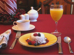 Breakfast being served on the table/ Includes Oatmeal pudding and orange juice